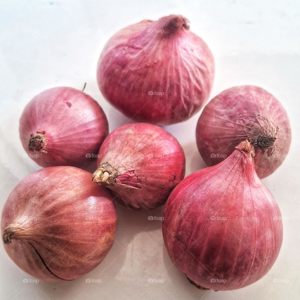These large shallots are harvested by Balinese farmers which are sold at traditional markets in Jember, East Java, Indonesia.