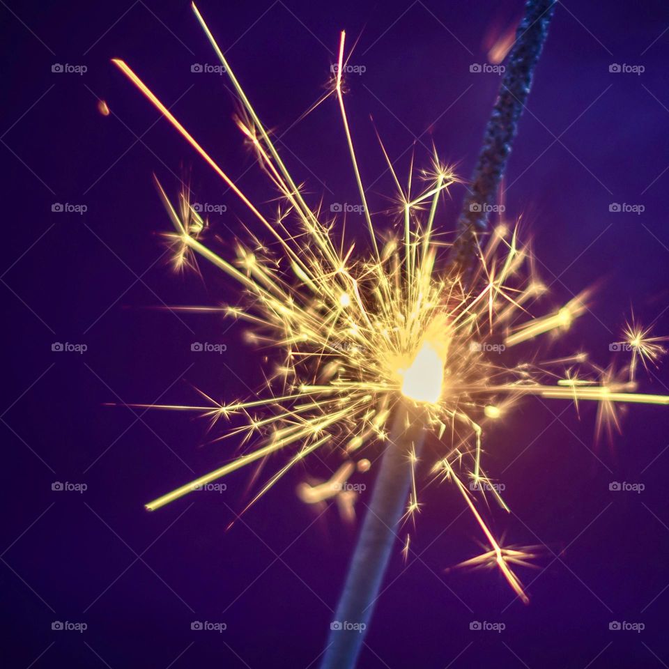 Yellow sparks on a purple background 