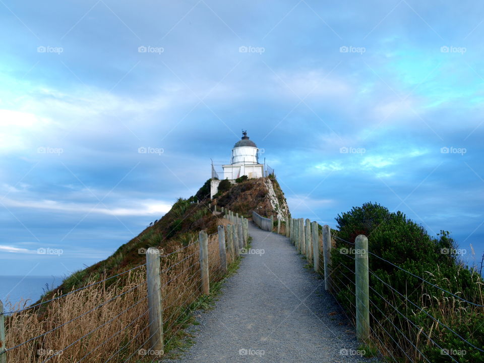 stormy clouds over the Nugget Point lighthouse in new Zealand