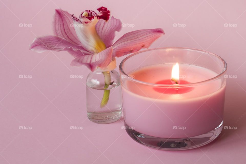 Pink orchid flower and candle 