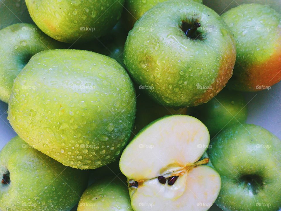 drops of water on green apple varieties of simirenko