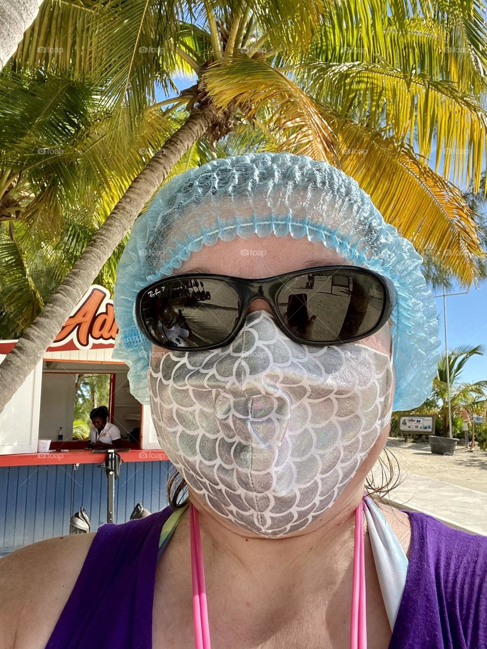 Wearing a hair net before putting on a helmet to do a Segway tour in the Bahamas