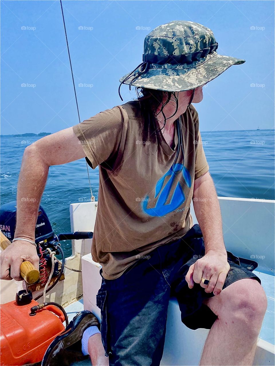 Experienced sailor “Timothy Trespas” aboard our new boat that we are motoring home to “Newtown Creek” in LIC, Queens from the “Mamaroneck” marina is testing the winds and taking in the sights. 2023. Hypnotic Productions