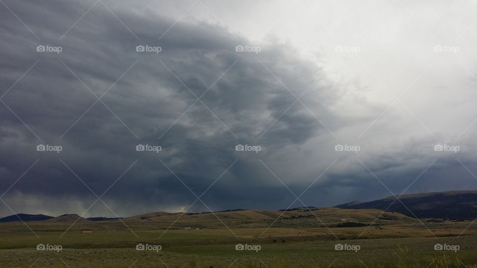 Dramatic storm clouds in the horizon 