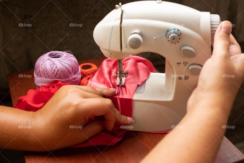 Working at the sewing machine