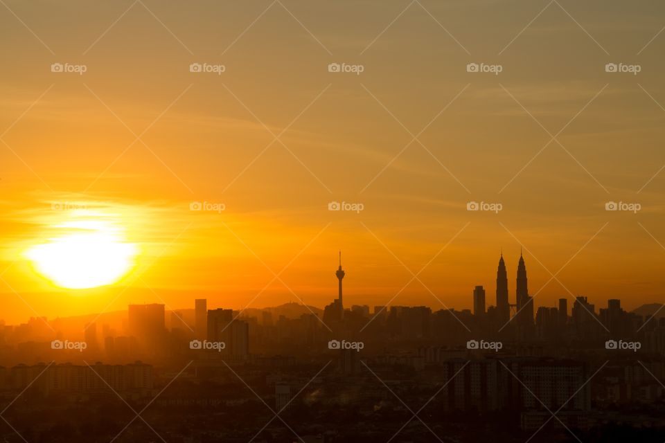 Sunset photo of Kuala Lumpur. Silhouette sunset photo of Kuala Lumpur. Peyton's tower clearly identifiable. 