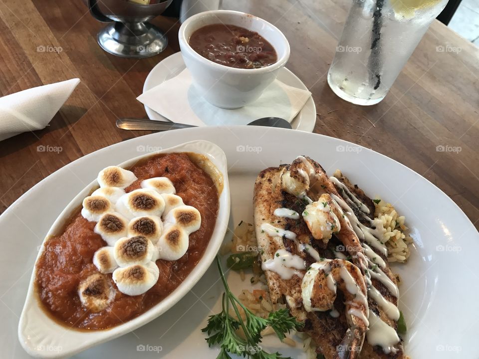 Tilapia and sweet potato casserole and pinto beans at Fish Daddies in Tulsa, Oklahoma