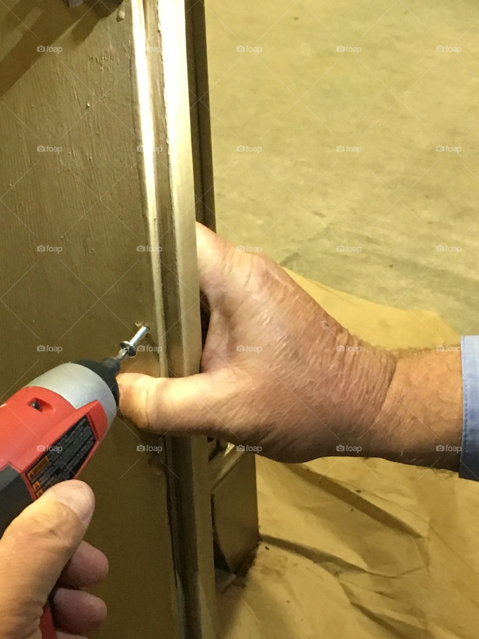 Putting hardware on cabinetry 