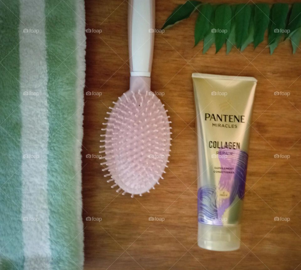 Pantene hair conditioner, comb and towel