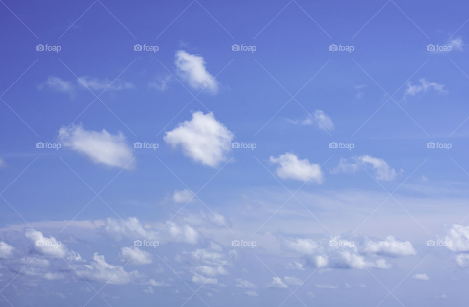 The beauty of the sky with clouds and the sun.