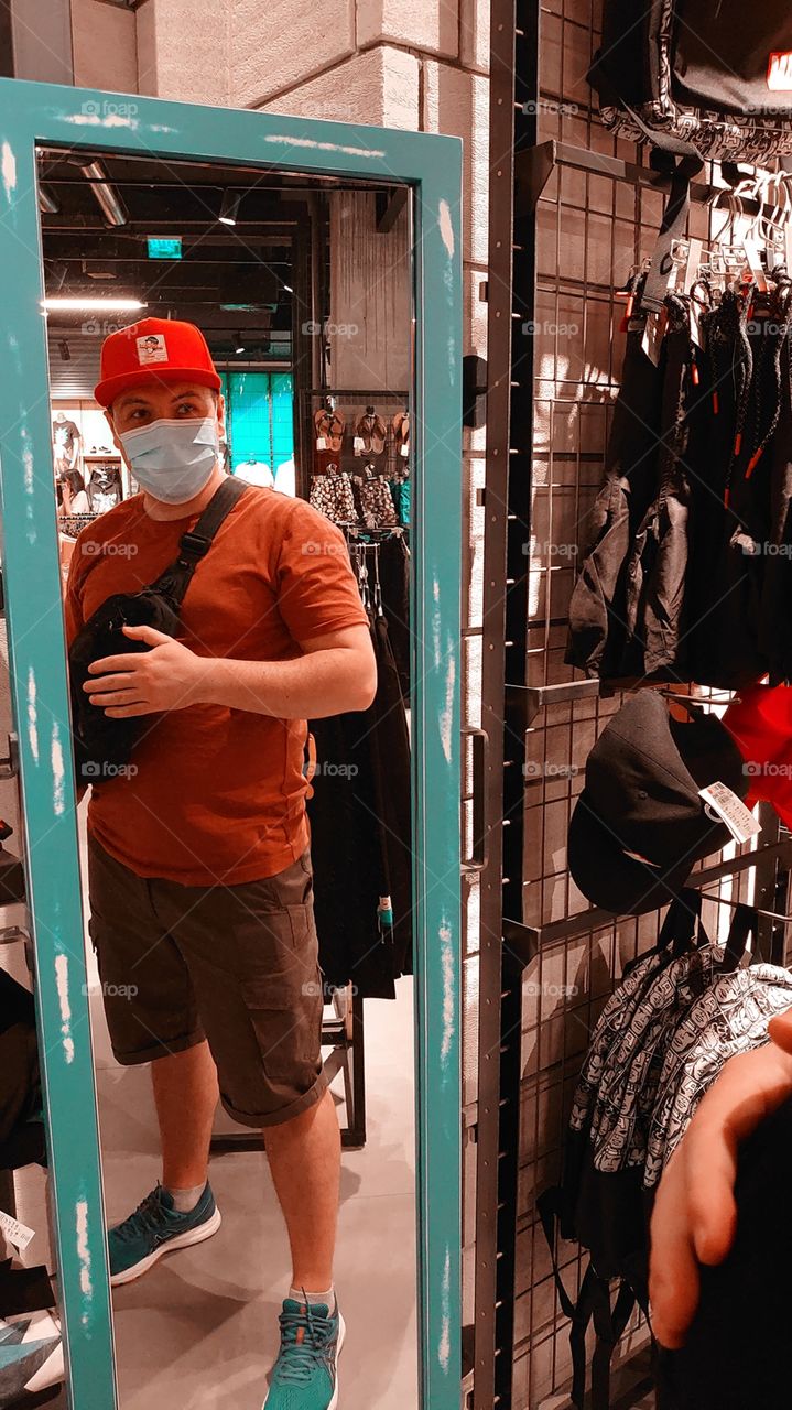 photo reflection in the mirror of a man