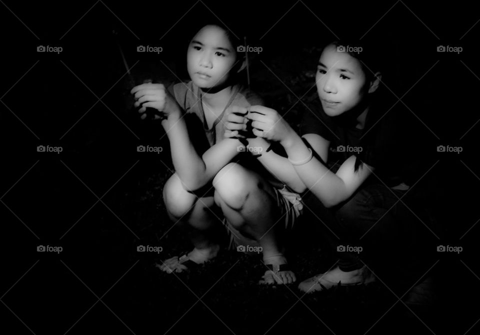 Two sisters preying at night