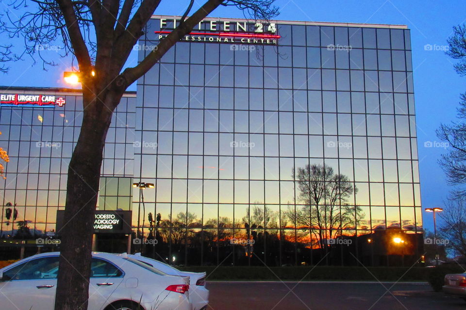 Building with sunset reflection