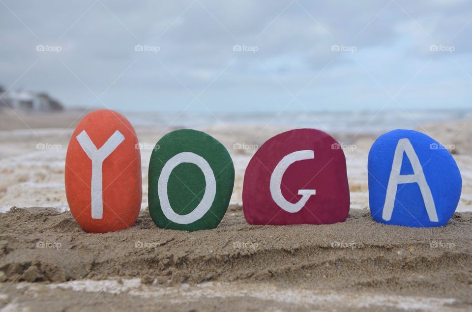 Yoga on colourful stones