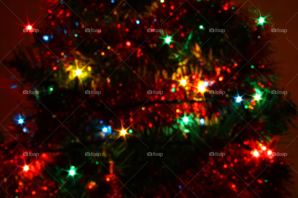 Macro shot of Christmas tree decorations and vivid lights