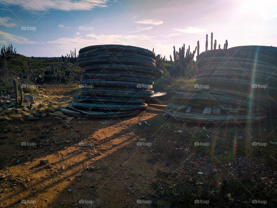Round wooden plates stacked up in the desert sun ⛅