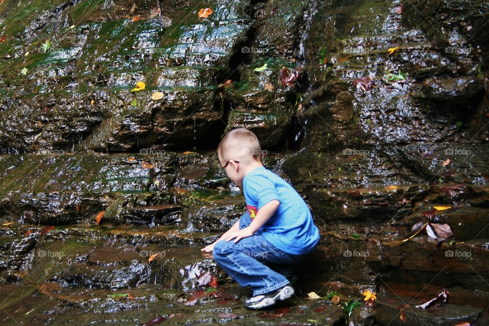 Playing in a waterfall
