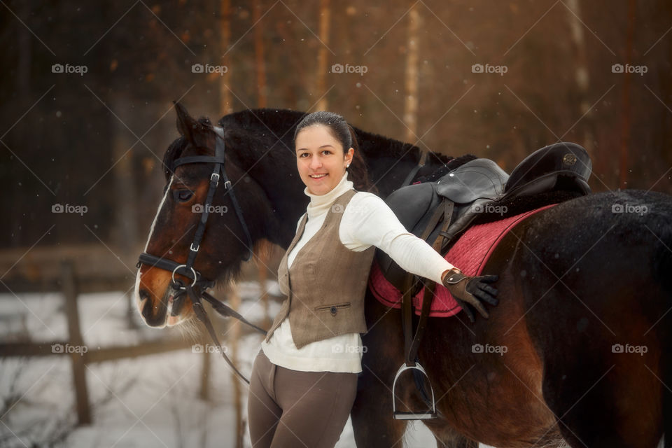 Young beautiful woman with horse outdoor portrait at spring day