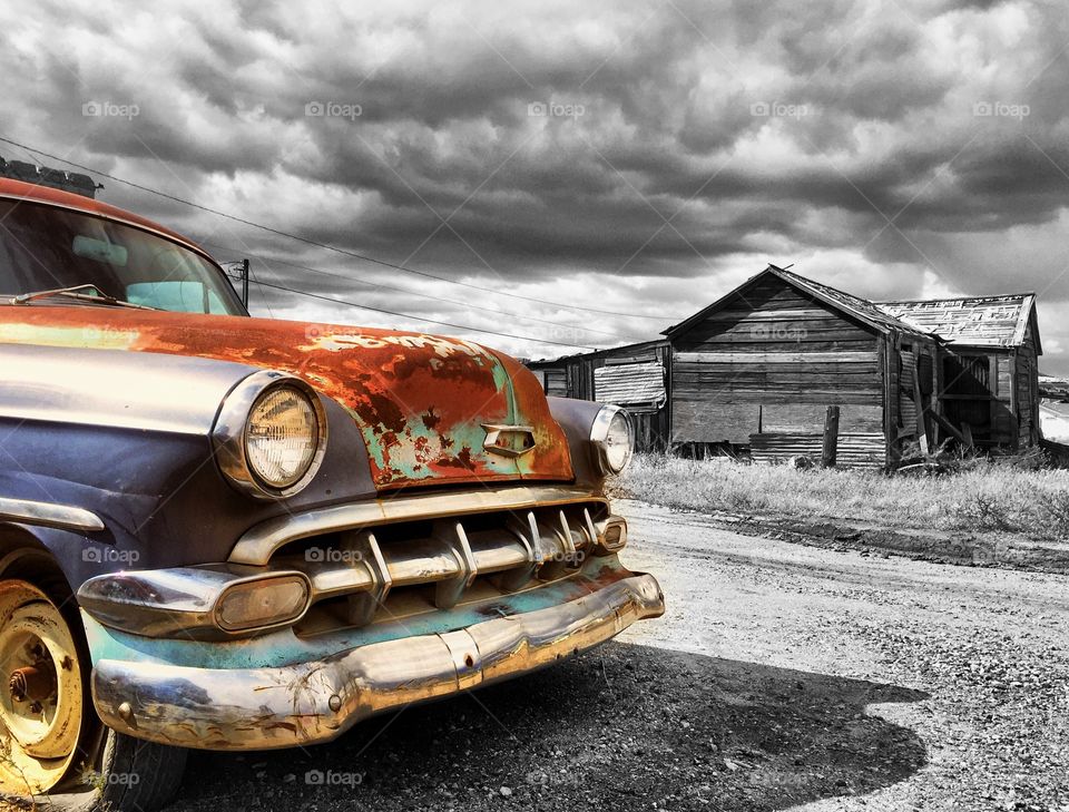 Rusty vintage car on a cloudy day in goldfield Nevada.
