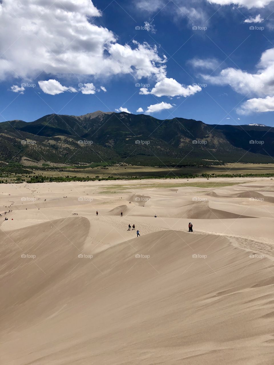Sand dunes, sky, mountains, clouds 
