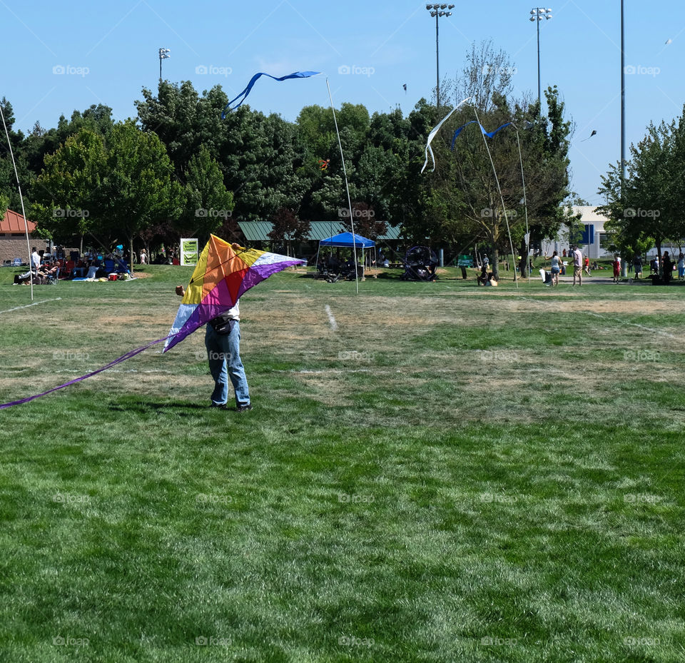 Man trying to launch a kite