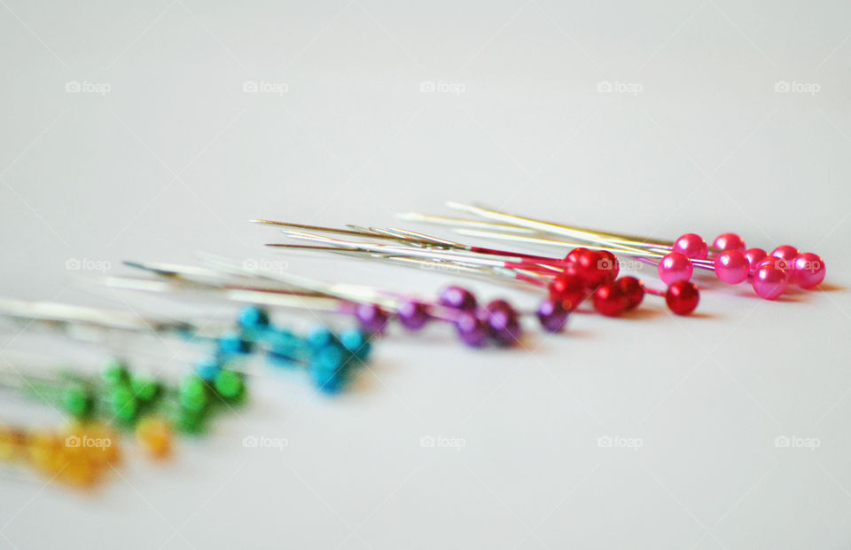macro shot, colored ball point pins, sewing