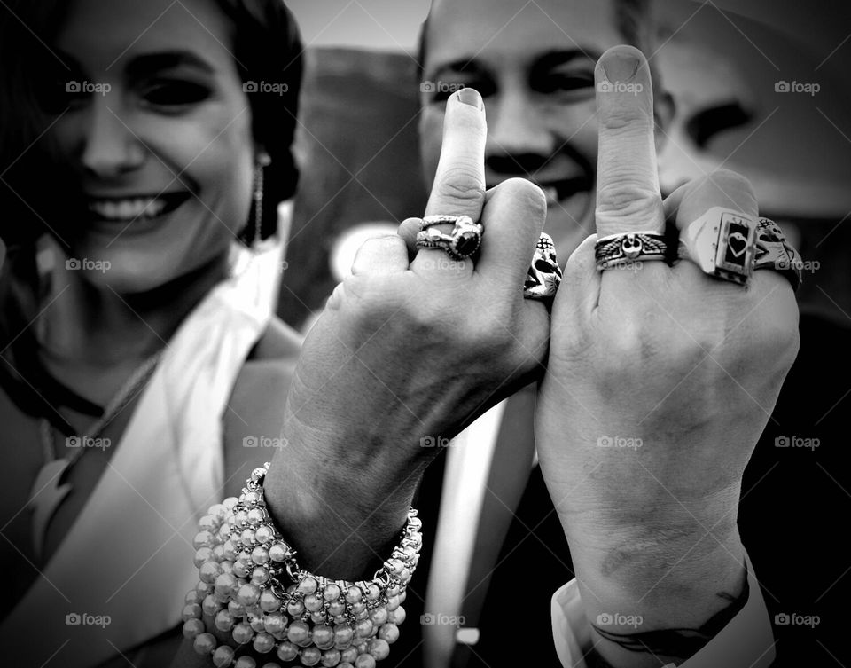 Bride and groom show off rings, moments of happiness in marriage, glimmers of hope, black and white wedding photos, funny ring photos, moments of joy