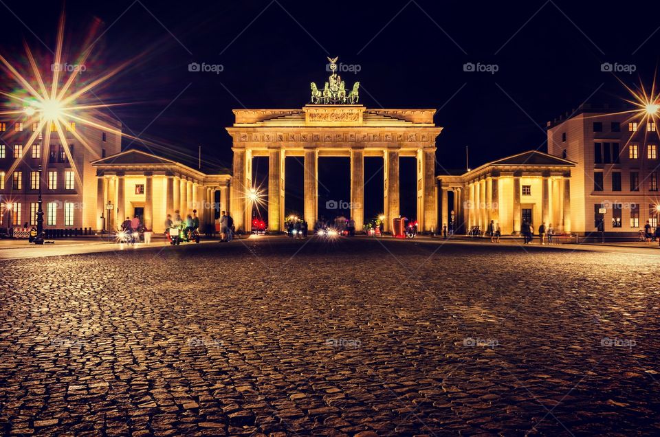 Long exposure photo of Brandenburger Tor in Berlin, Germany at night.