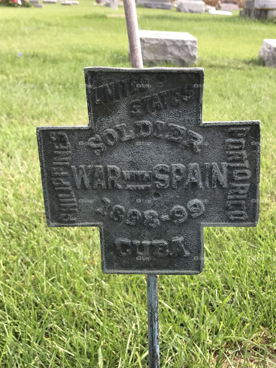 A grave marker for a fallen soldier from the war with Spain.