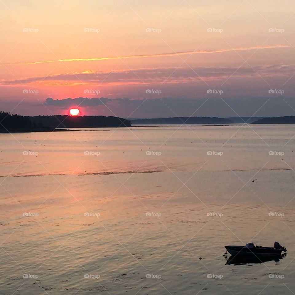 sunset over ocean . summer night in harpswell, Maine