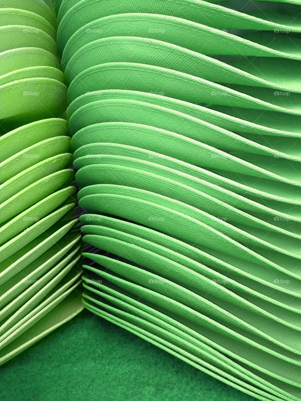 Stack of green hats-symmetry 