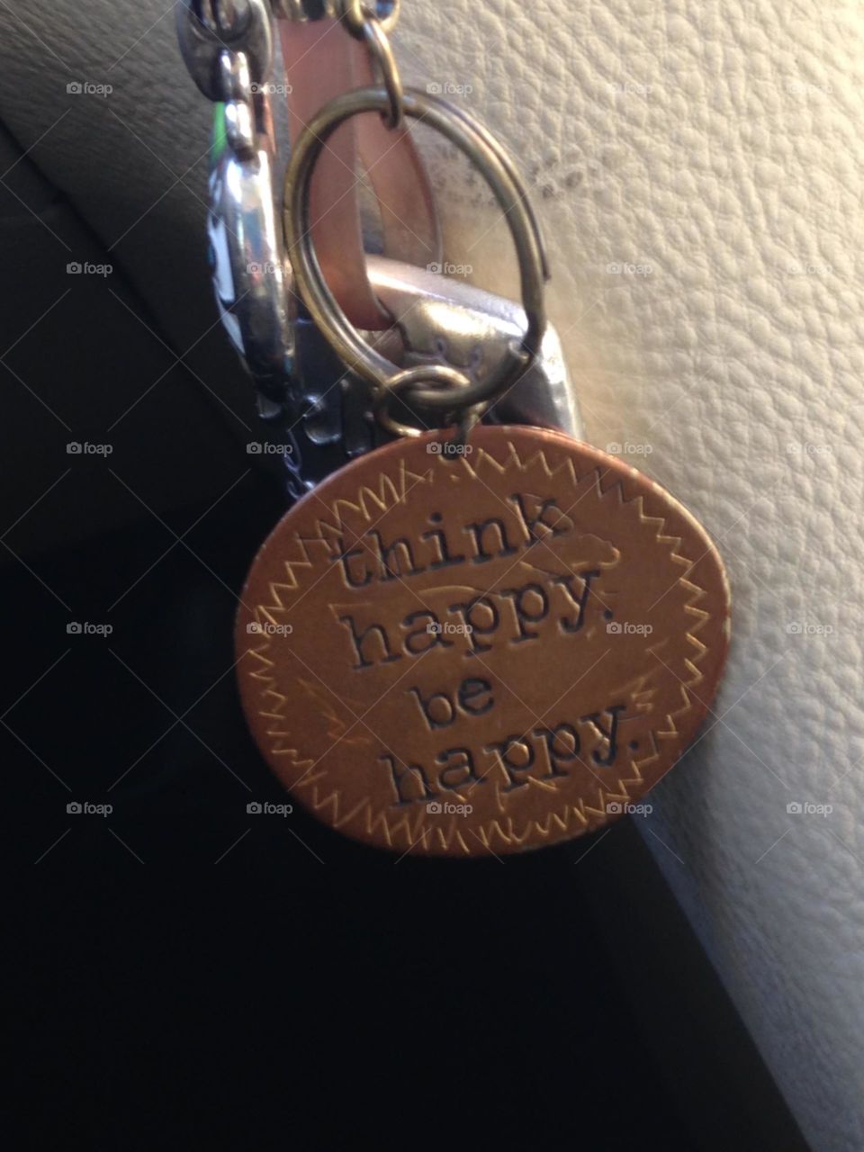 Remind me.. This picture of a key chain that was given to someone I love as a simple reminder to always be happy.