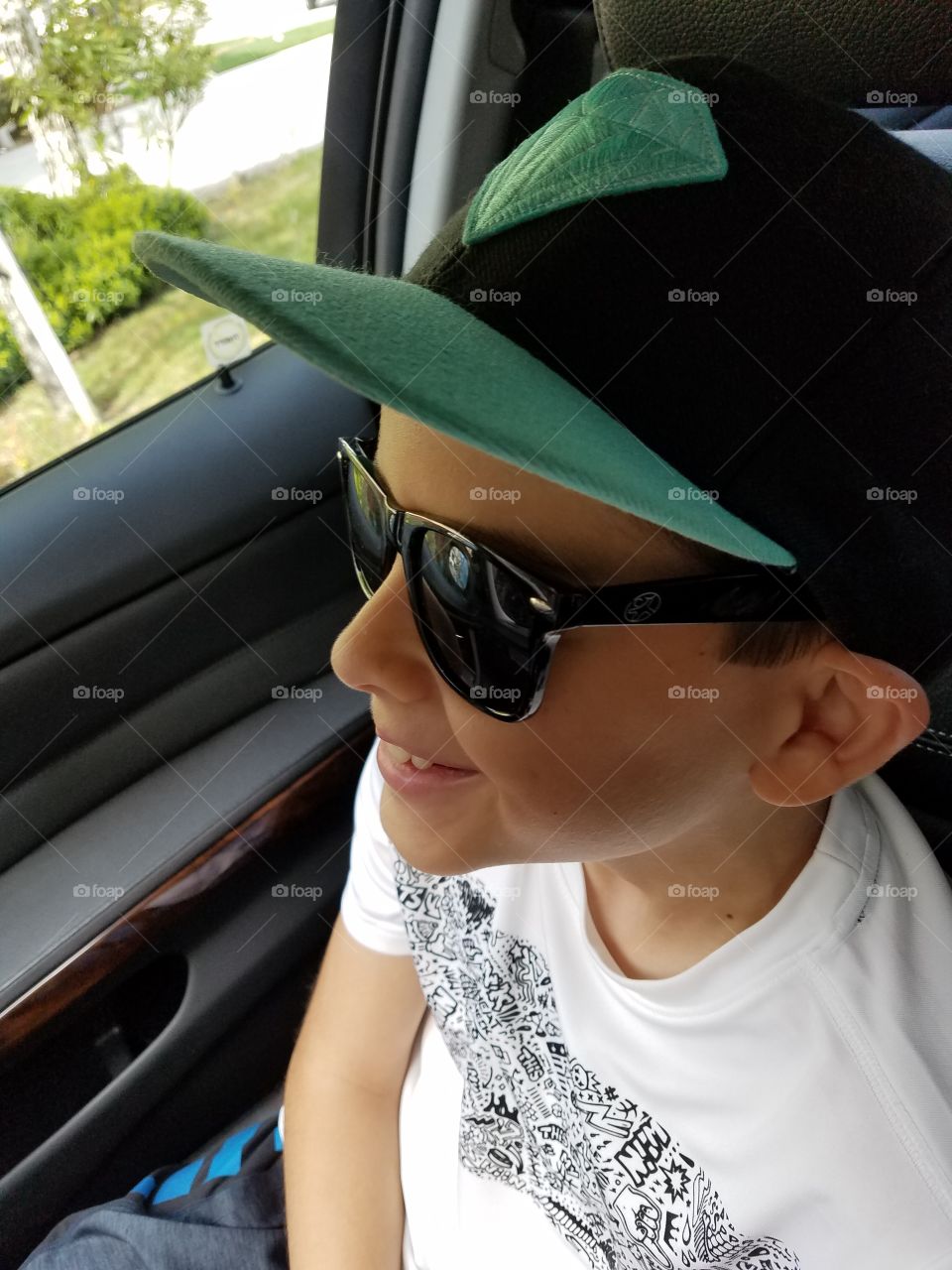 boy cool in car cap blue