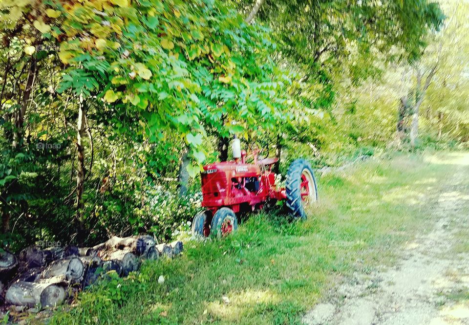 Driving the Back Roads and enjoying everything around us. Old tractor