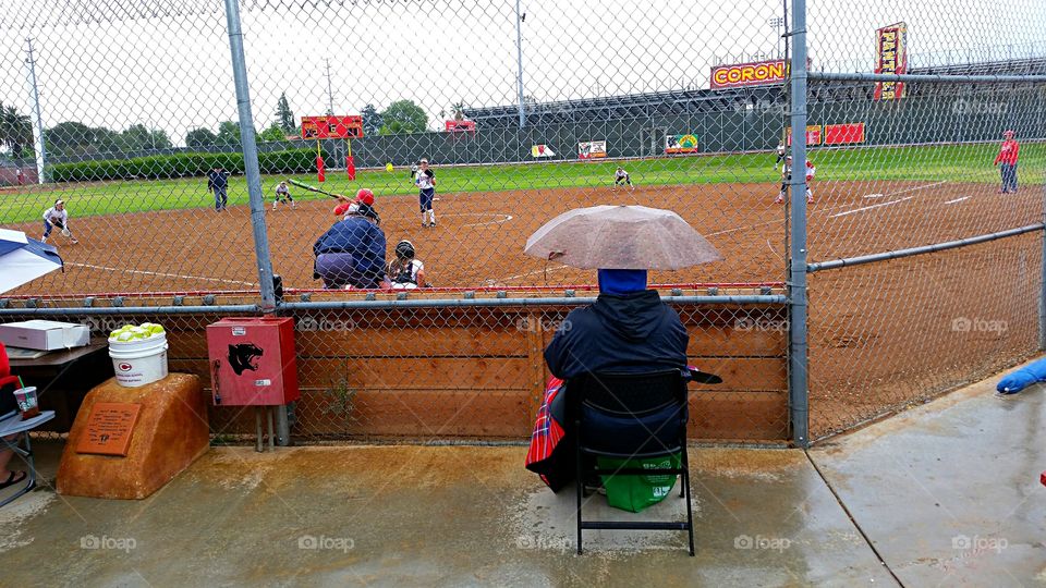 Softball in the rain. Last game of the season, played in the rain.
