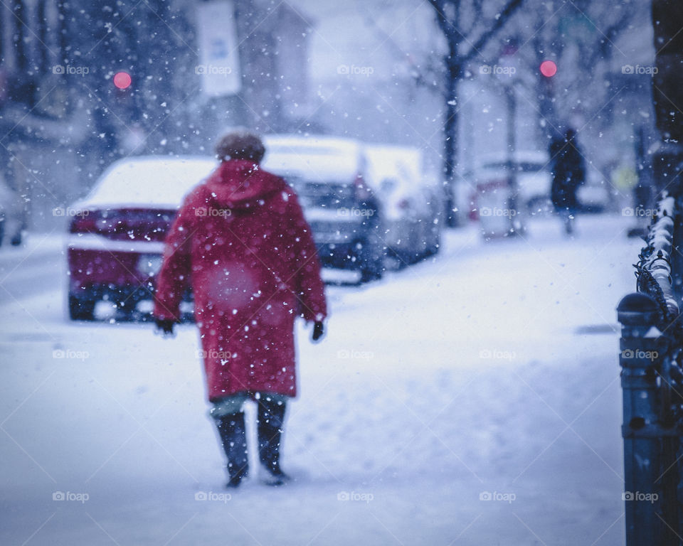 A lady walking in snow