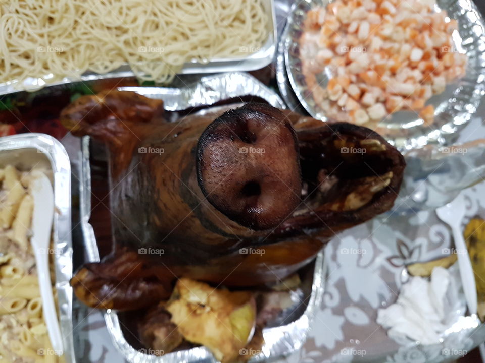 lechon head: roasted suckling pig, head only