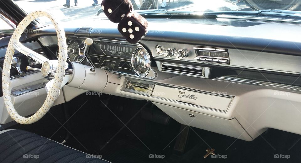 caddy chrome. this sharp cadillac interior caught my eye at the vintage car show. amazing design lines, lots of chrome, and fuzzy dice!
