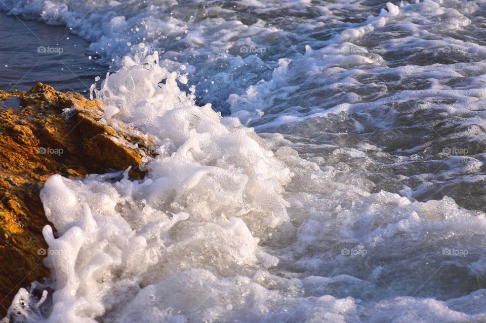 waves crushing on rocks