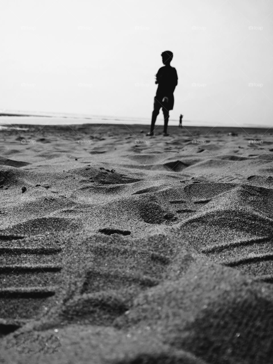 a photographer boy finding objects for click