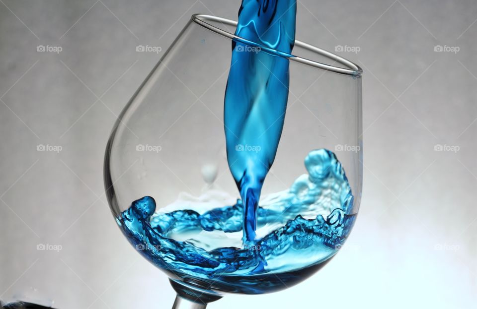 Drink pouring in glass