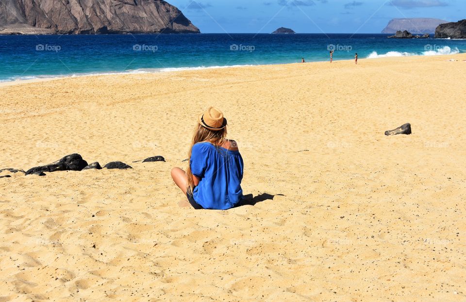 woman on las conchas beach on graciosa canary island in Spain