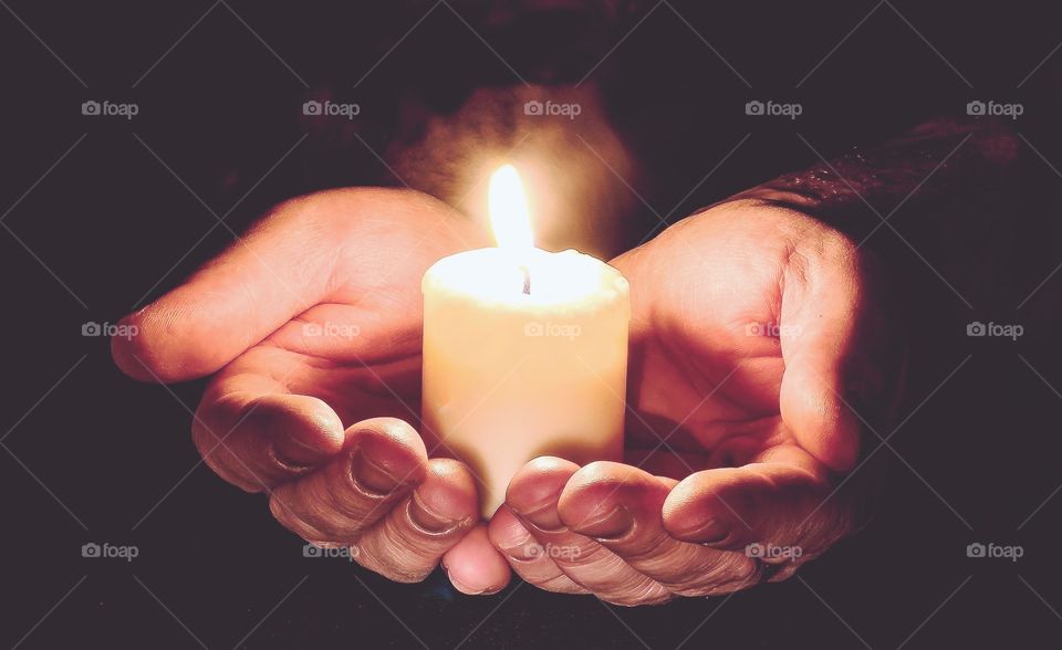 hands with candle