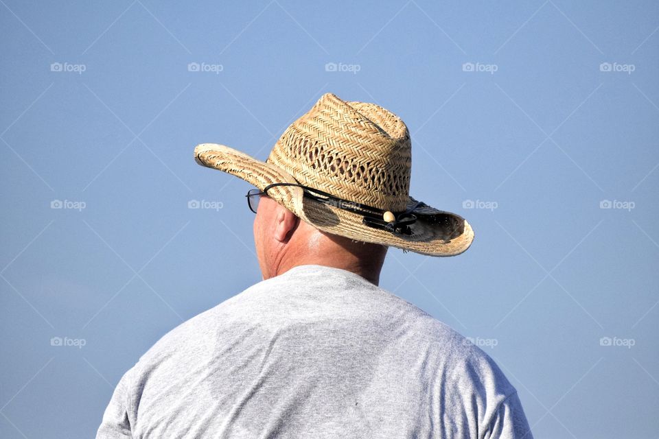 Man in Hat on a Hot Day