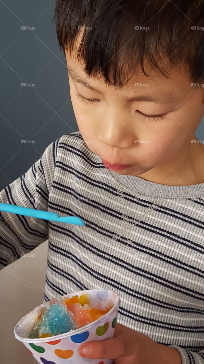 Portrait of boy eating ice cream