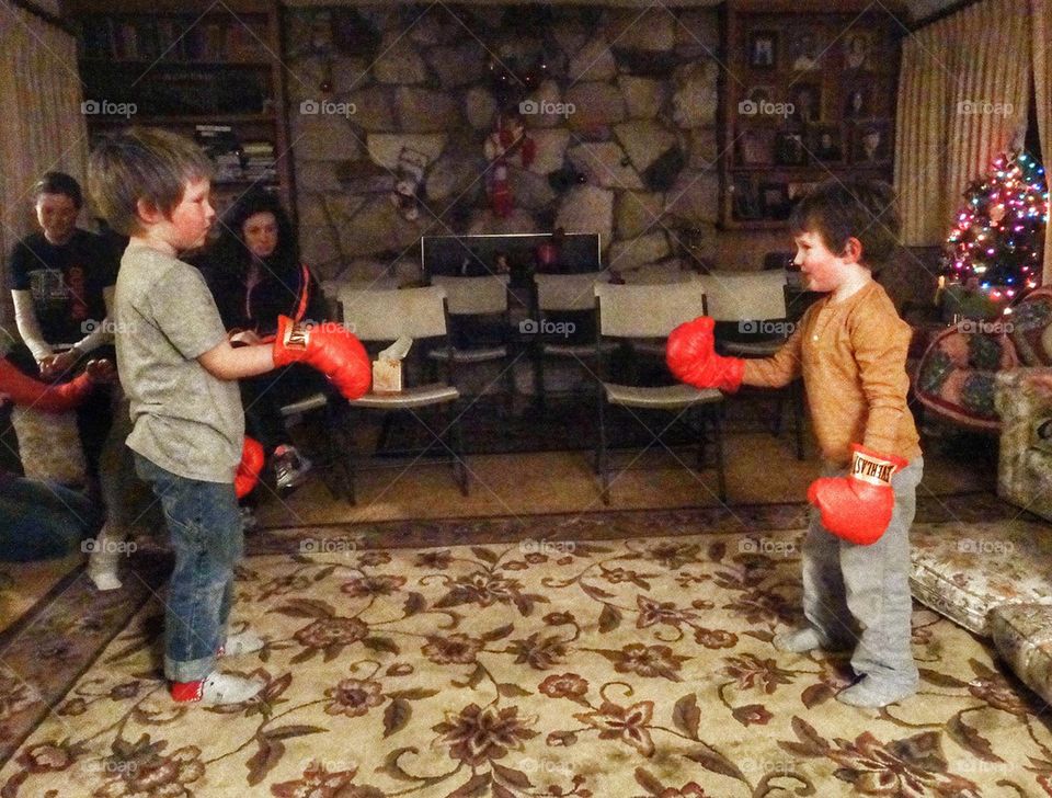 Sibling Rivalry. Young Brothers With Boxing Gloves
