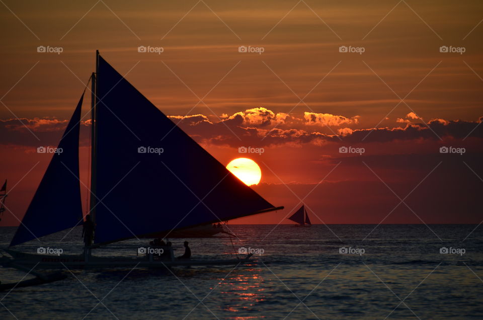 Boat during magic sunset in the Philippines