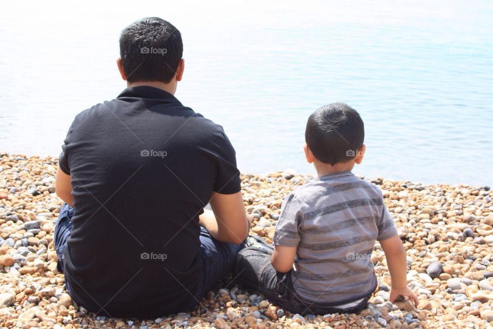 family seaside father son by uzzidaman