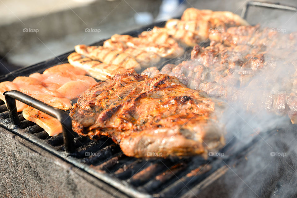 Cooking meat on barbecue