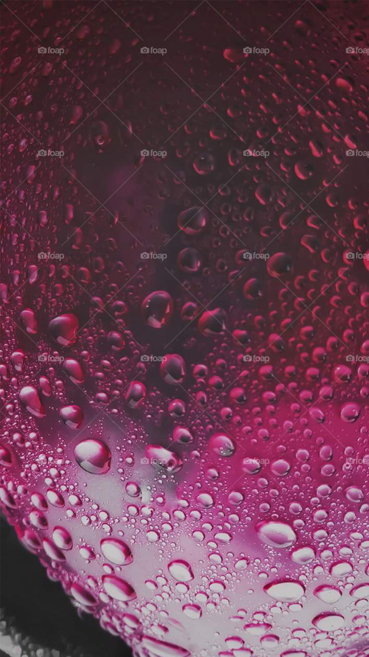 Water droplets on a pink balloon